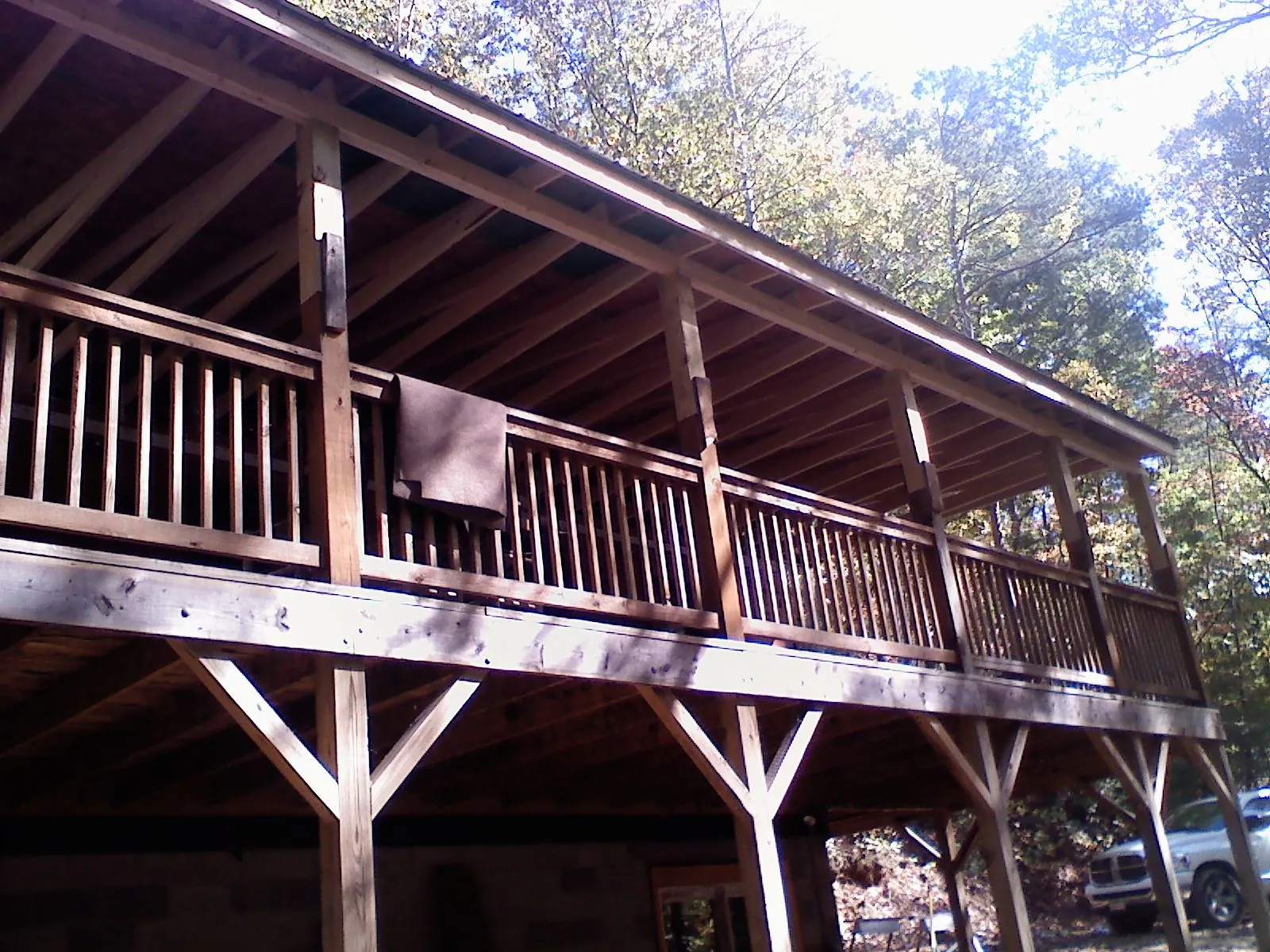 Timber framing under a new elevated porch and deck in Cottekill